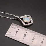‘Lark’ Oval Opal Kite Frame Pendant – ruler close up