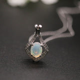 ‘Lark’ Oval Opal Kite Frame Pendant – angled on chain