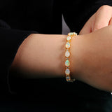 ‘Marigold’ Oval Opal Link Tennis Bracelet – on wrist