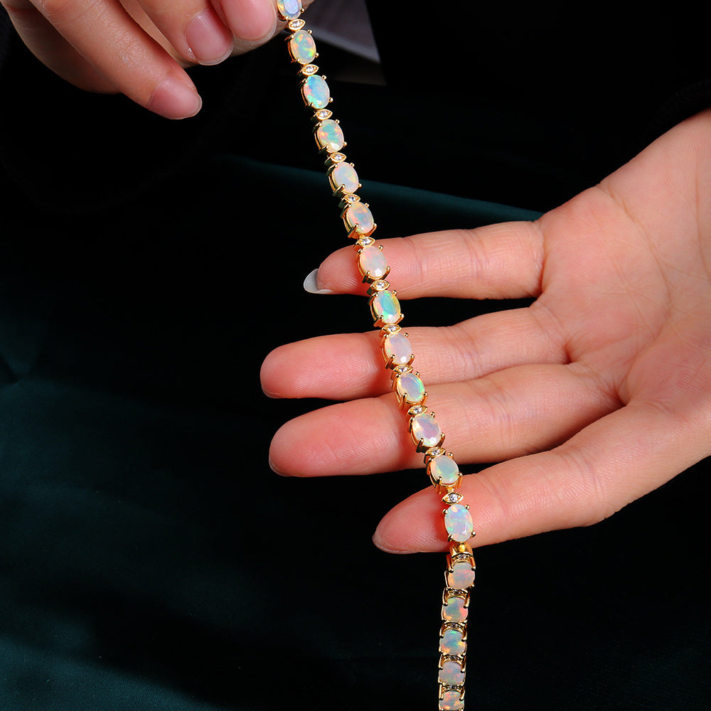 ‘Marigold’ Oval Opal Link Tennis Bracelet – held in hand