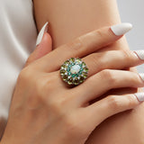 ‘Daintree’ Oval Opal Peridot Sunburst Set – ring on hand