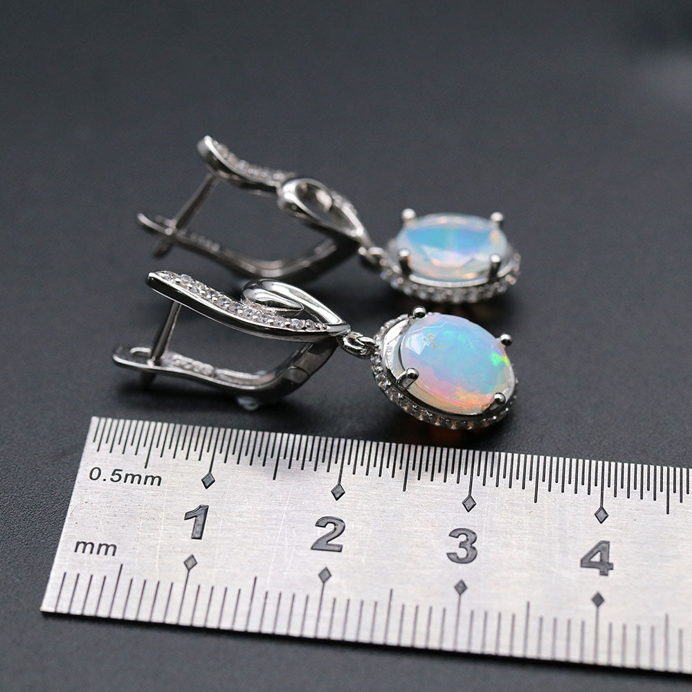 ‘River’ Oval Opal Swirl Drop Earrings – on ruler