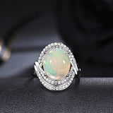 ‘Cove’ Oval Opal Swirl Halo Ring – top view