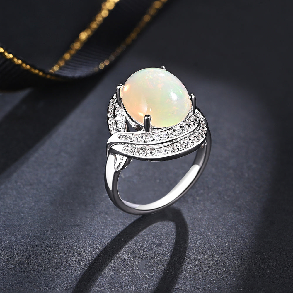 ‘Cove’ Oval Opal Swirl Halo Ring – side view