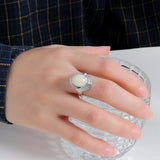 ‘Cove’ Oval Opal Swirl Halo Ring – on hand