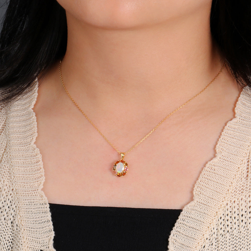 ‘Carmel’ Oval Opal Tourmaline Halo Pendant – on neck cardigan