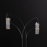 ‘Effie’ Oval Round Opal Huggie Earrings – on display stand