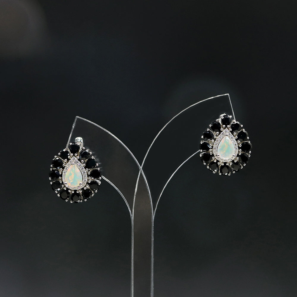 ‘Pepper’ Pear Opal Black Spinel Earrings – on display stand