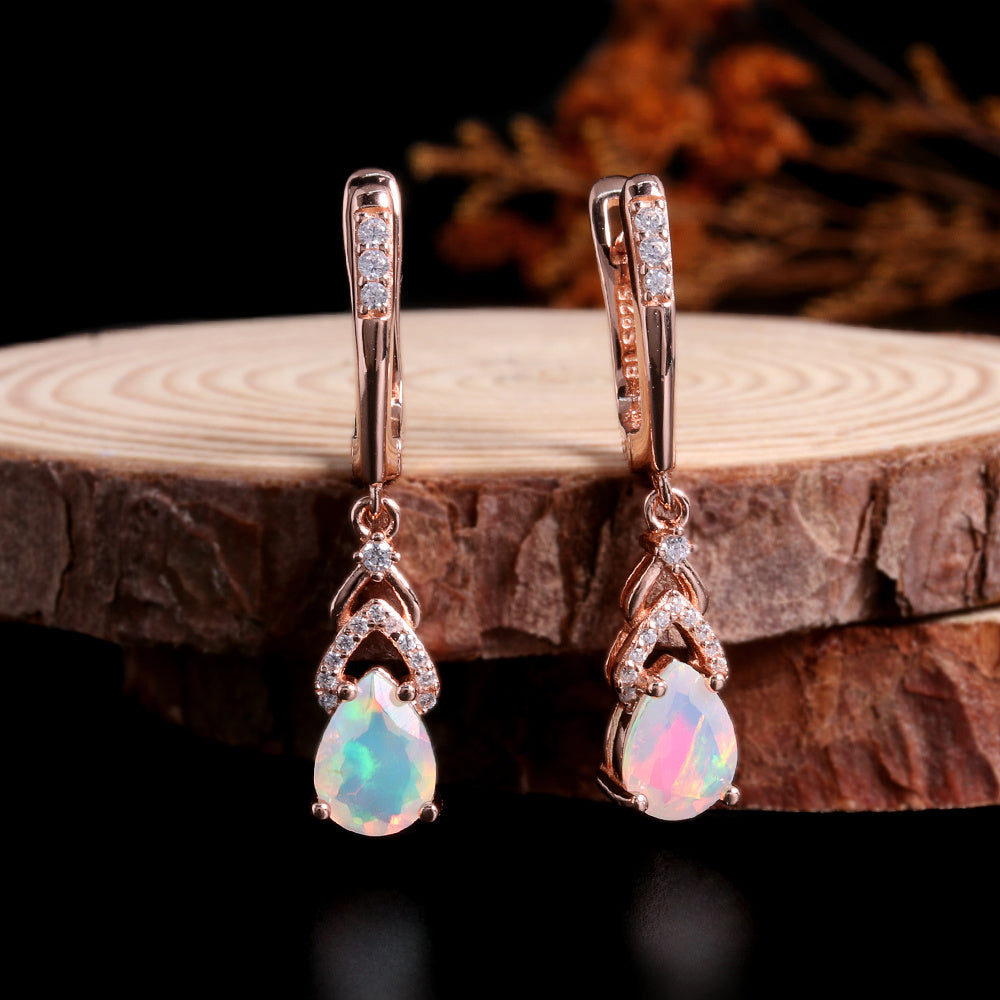 ‘Rose’ Pear Opal Chevron Drop Earrings – on wood slice