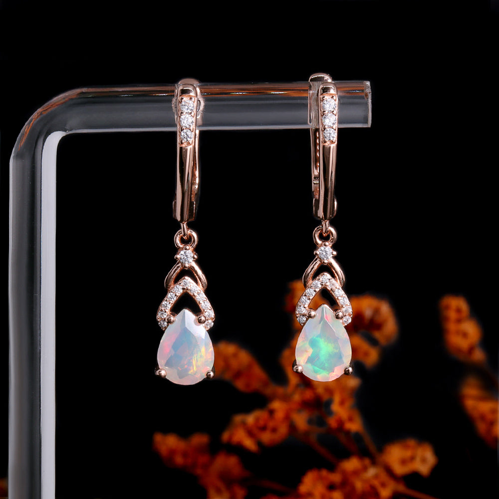 ‘Rose’ Pear Opal Chevron Drop Earrings – hanging on stand