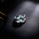 ‘Caroline’ Pear Opal Cluster Cocktail Ring – on dark fabric