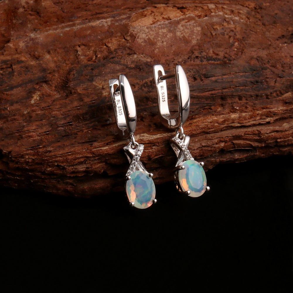 ‘Ainsley’ Pear Opal Crossover Drop Earrings – on wood