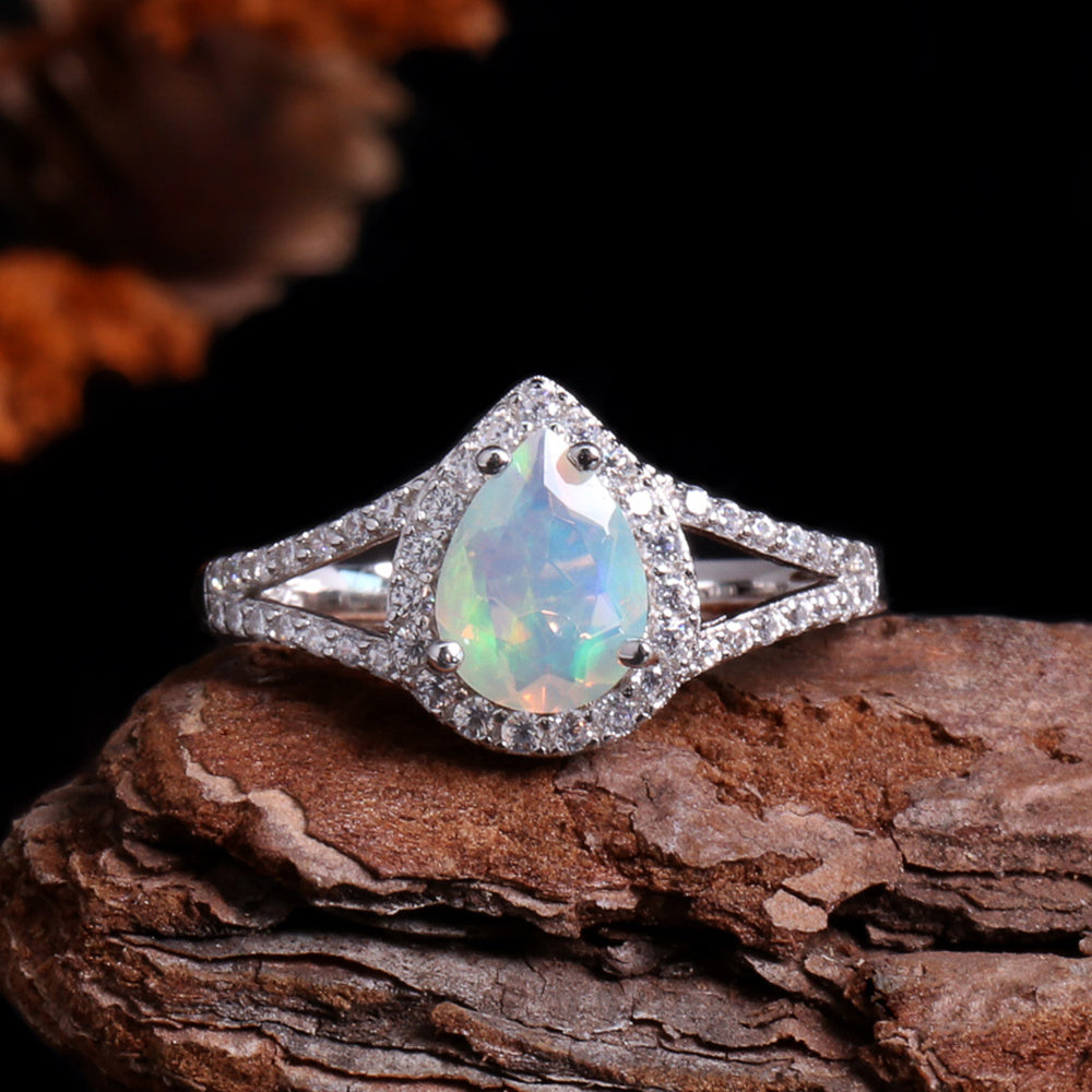 ‘Josie’ Pear Opal Halo Trio Set – ring on wood