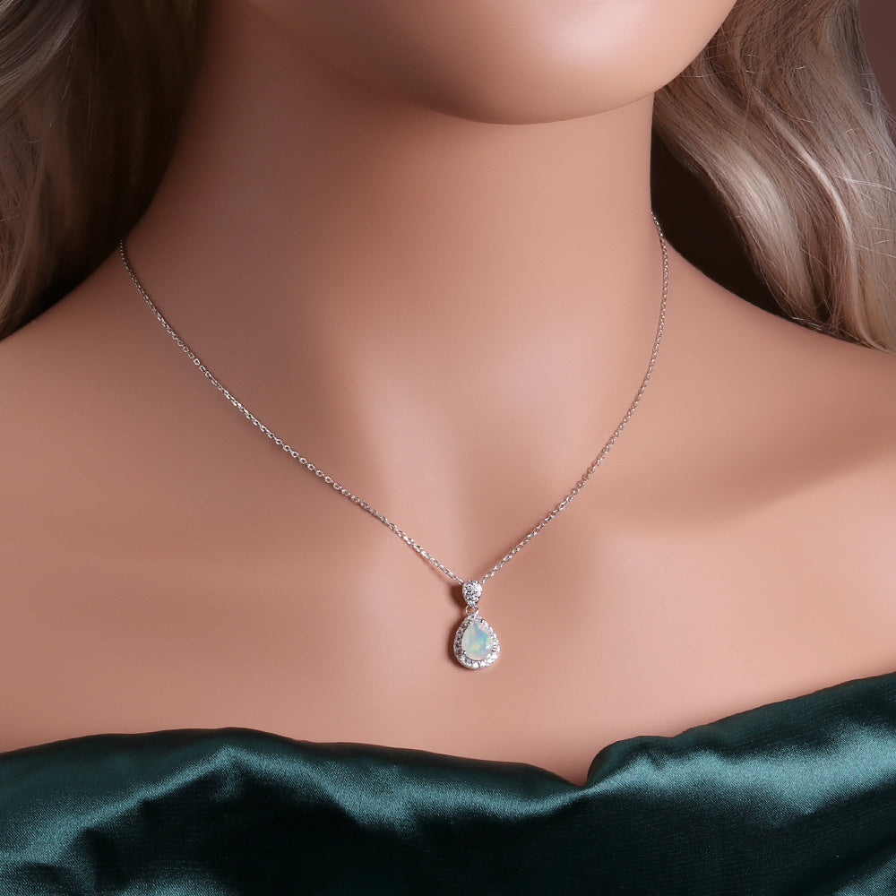 ‘Josie’ Pear Opal Halo Trio Set – pendant on neck