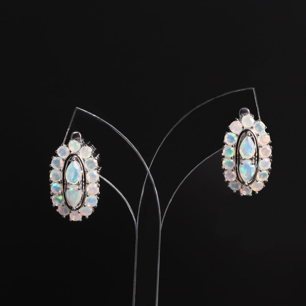‘Scarlet’ Pear Opal Oval Halo Earrings – on display stand