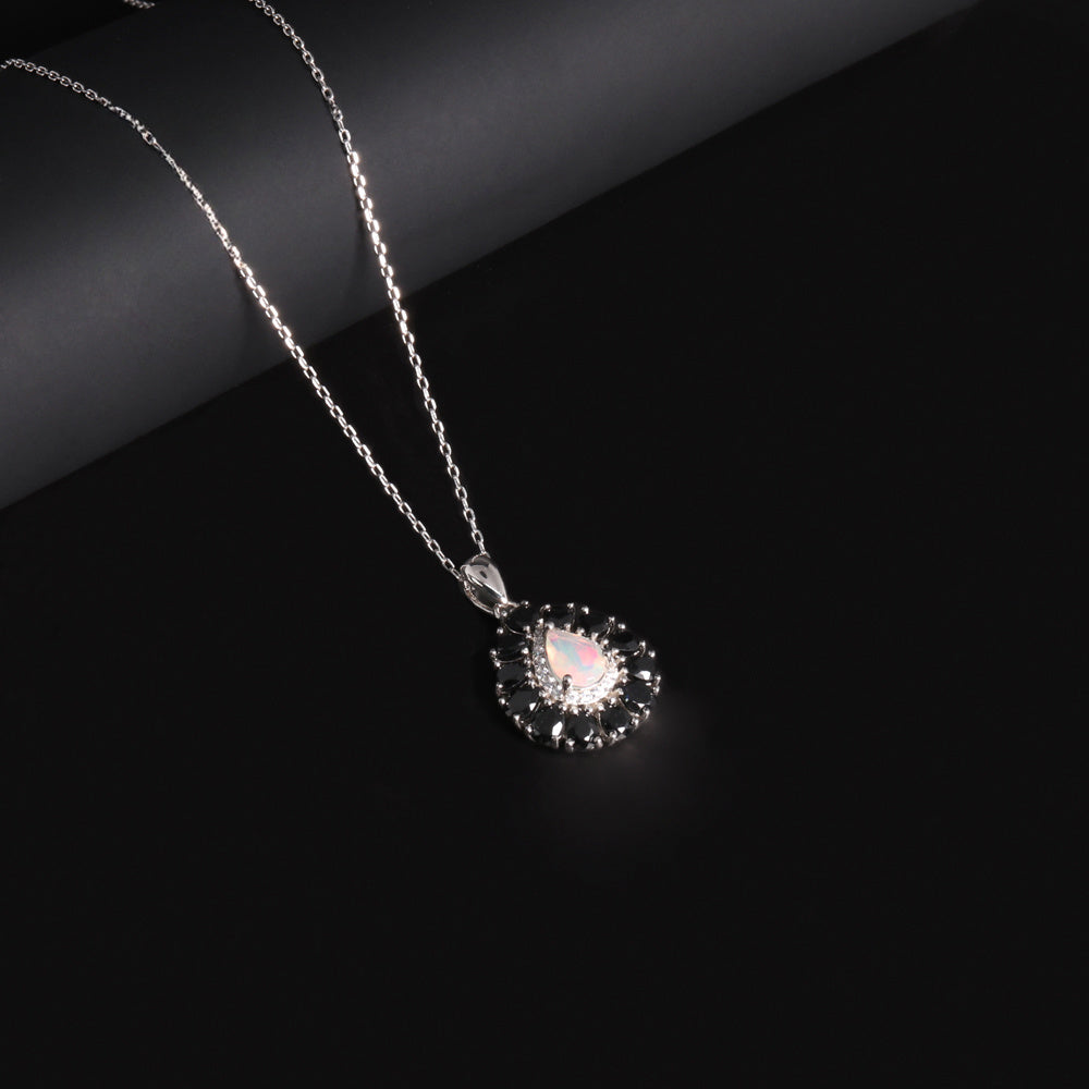 ‘Greta’ Pear Opal Spinel Halo Necklace – angled view
