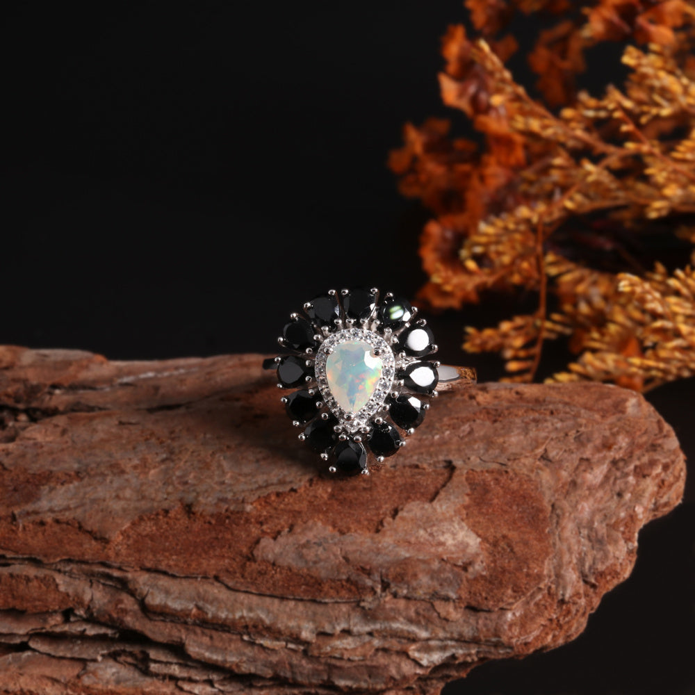 ‘Vela’ Pear Opal Spinel Halo Ring – on rock