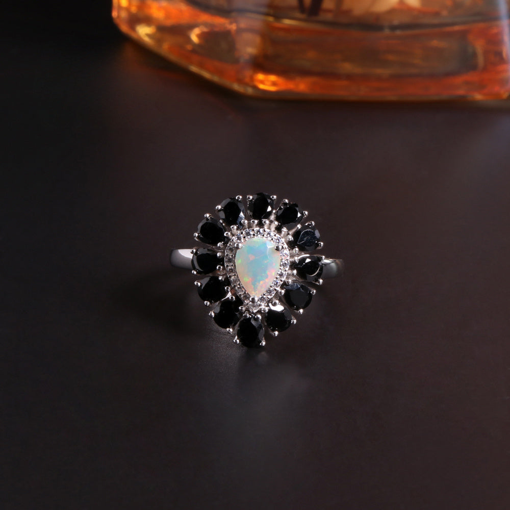 ‘Vela’ Pear Opal Spinel Halo Ring – angle view 2