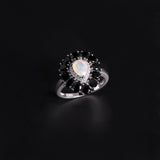 ‘Vela’ Pear Opal Spinel Halo Ring – angle view