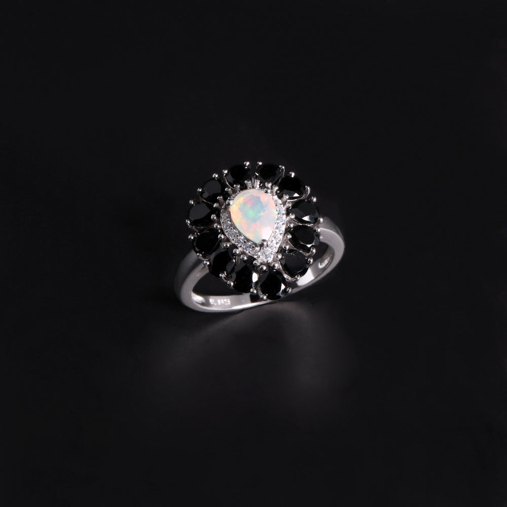 ‘Vela’ Pear Opal Spinel Halo Ring – angle view