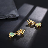 ‘Georgia’ Pear Opal Swirl Drop Earrings – lying on slate