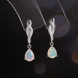 ‘Palmer’ Pear Opal Twist Drop Earrings – on display stand