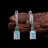 ‘Ellis’ Rectangle Opal Emerald Drop Earrings – on wood