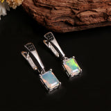 ‘Piper’ Rectangle Opal Tapered Bar Earrings – on wood angled