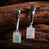 ‘Piper’ Rectangle Opal Tapered Bar Earrings – on wood front