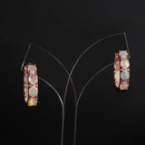 ‘Sunday’ Rose Gold Opal Hoop Earrings – hanging on stand