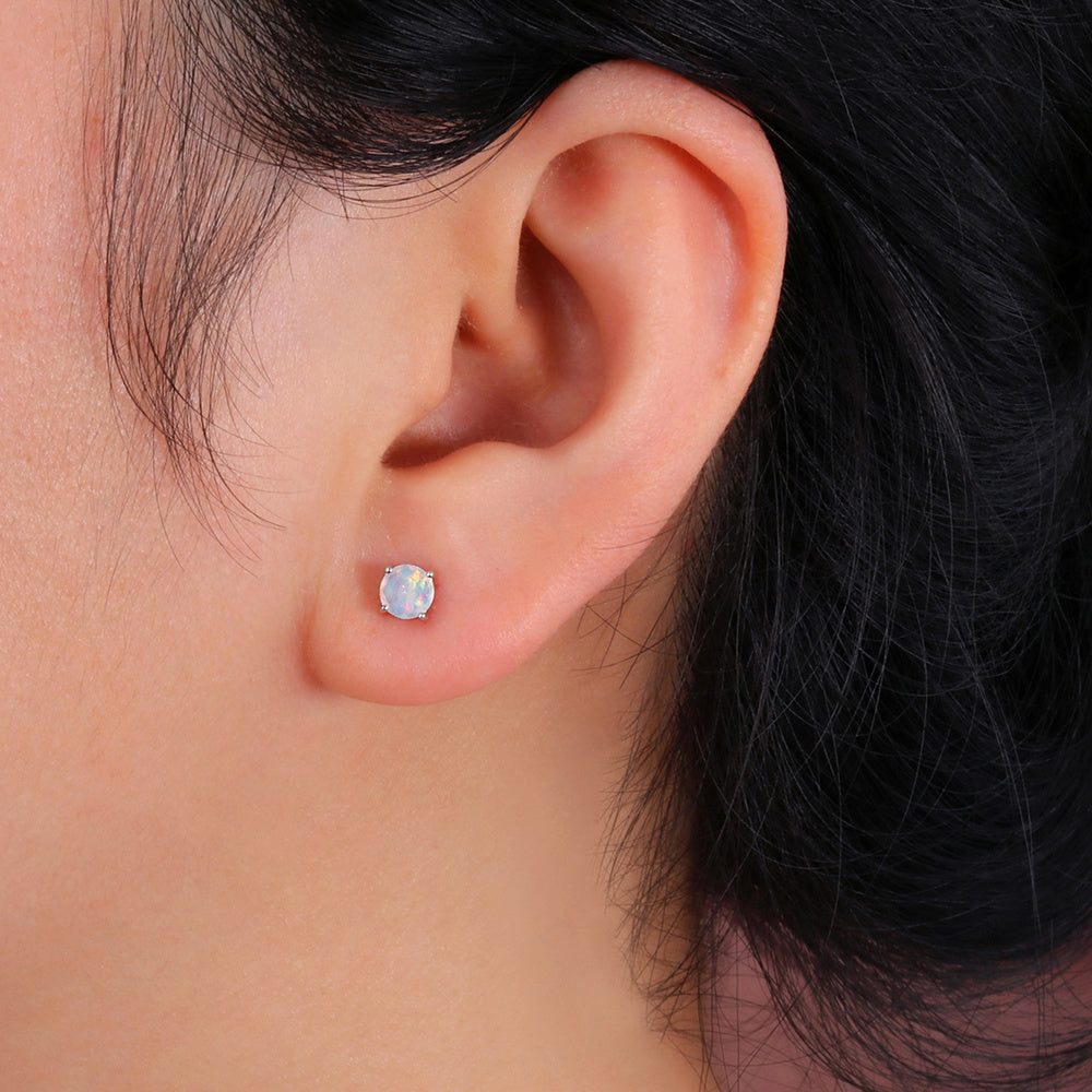 ‘Meg’ Round Faceted Opal Stud Earrings – on ear