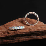 ‘June’ Round Opal Eternity Band Ring – on wood