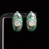 ‘Olive’ Round Opal Green Enamel Earrings – on display stand