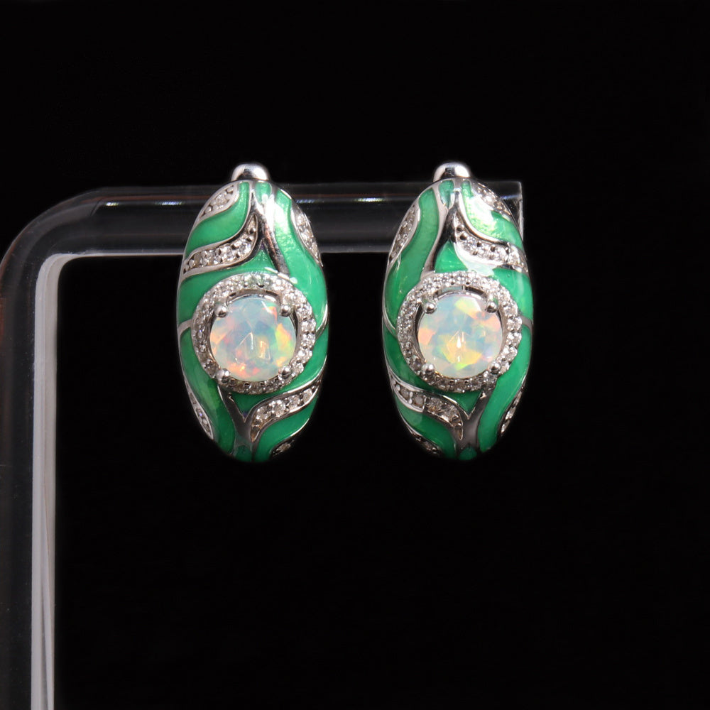 ‘Olive’ Round Opal Green Enamel Earrings – on display stand