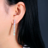 ‘Cora’ Round Opal Linear Bar Earrings – on ear