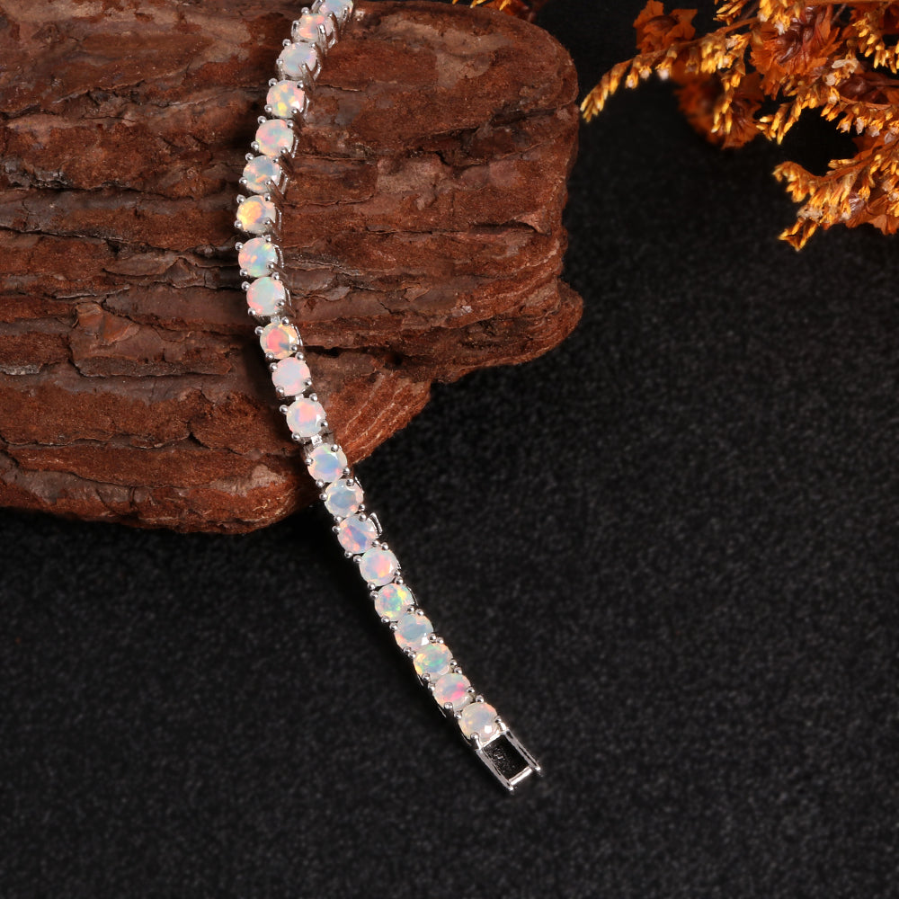 ‘Florence’ Round Opal Tennis Bracelet – draped on wood