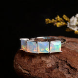 ‘Camden’ Square Opal Four Stone Ring – on wood