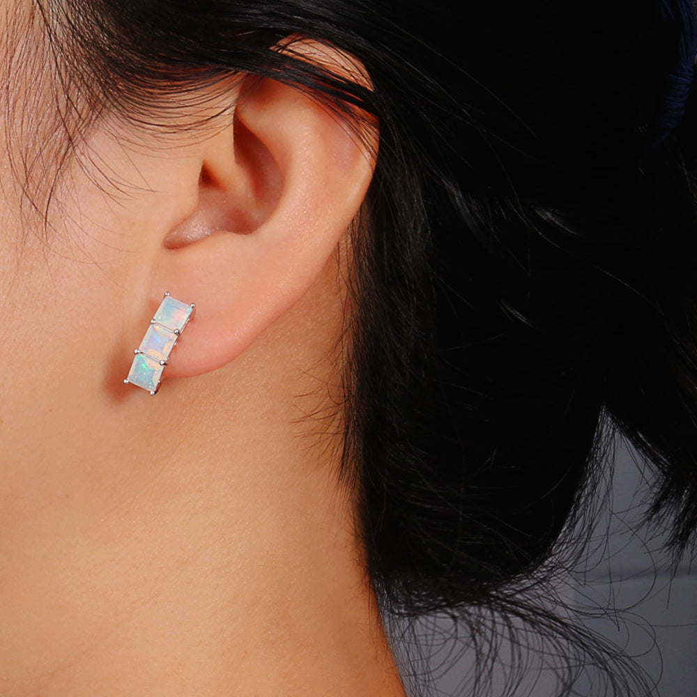 ‘Aubrey’ Square Opal Three Stone Set – earring on ear