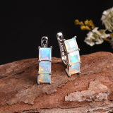 ‘Aubrey’ Square Opal Three Stone Set – earrings on wood