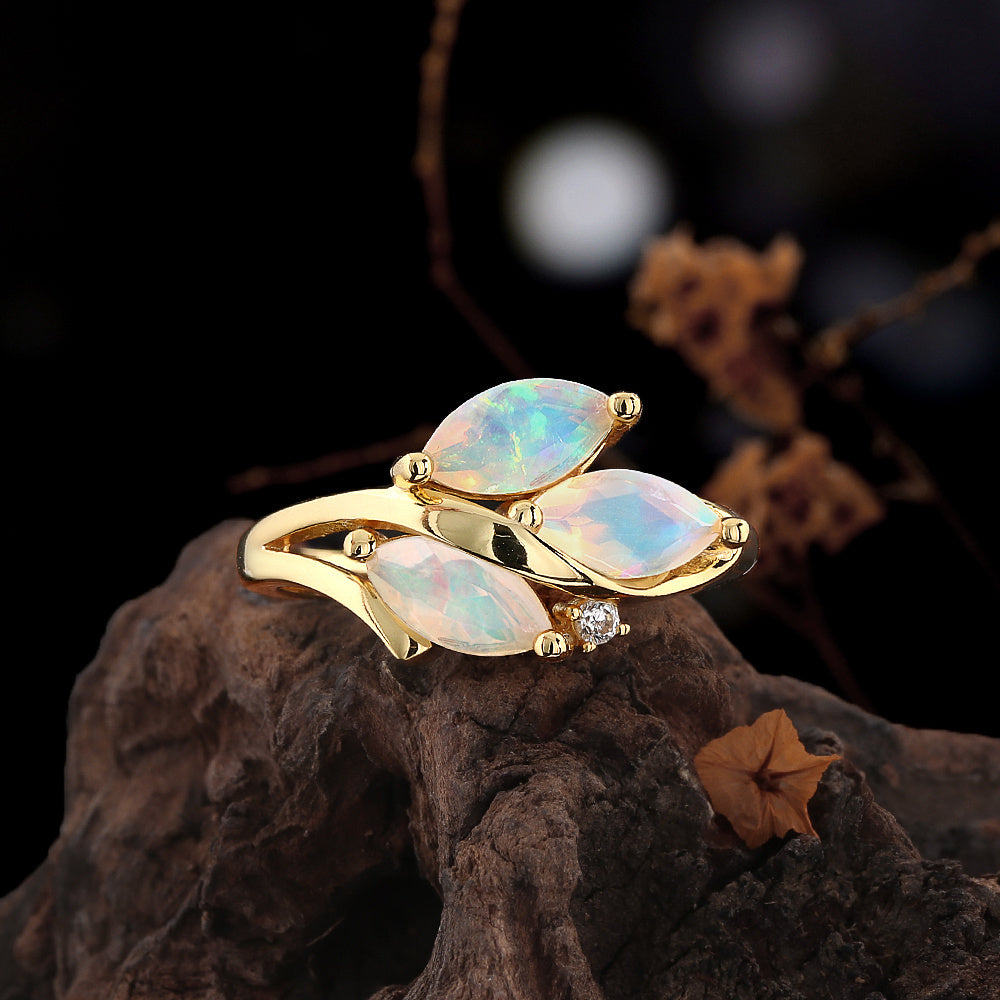 ‘Aspen’ Three Marquise Opal Leaf Ring – angle on wood