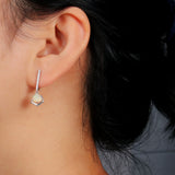 ‘Sedona’ Trillion Opal Geometric Drop Earrings – on ear